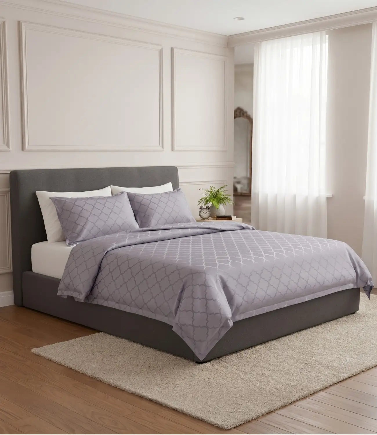 Premium silver grey cotton bedsheet with contemporary geometric print displayed on a king size bed in a bright modern bedroom.