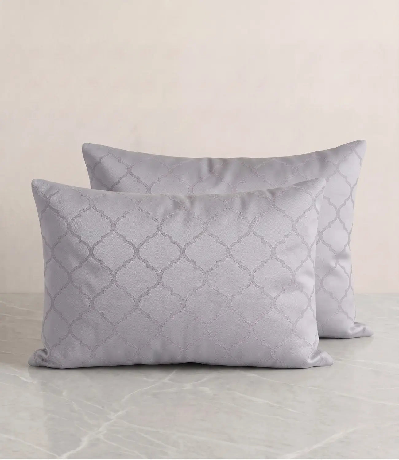 Set of two silver grey cotton pillow covers featuring a minimalist geometric pattern for modern bedroom décor.