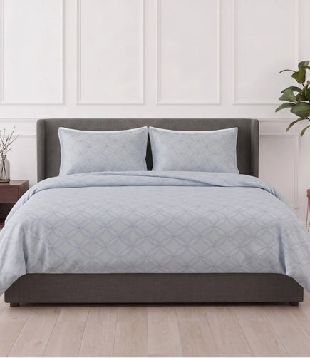 Premium king size 100% pure cotton slate blue geometric bedsheet with matching pillow covers, styled in a modern bedroom featuring breathable fabric, soft texture, and an elegant circular pattern.