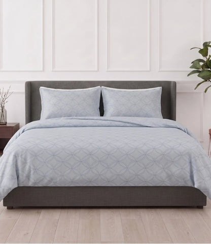 Premium king size 100% pure cotton slate blue geometric bedsheet with matching pillow covers, styled in a modern bedroom featuring breathable fabric, soft texture, and an elegant circular pattern.
