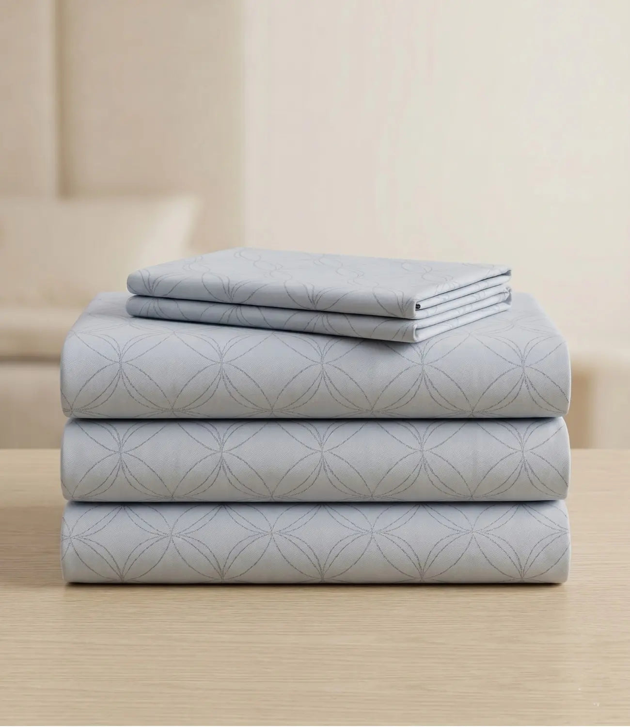 Folded king size 100% pure cotton slate blue geometric bedsheet showcasing breathable cotton fabric, subtle circular pattern, premium craftsmanship, durable stitching, and long-lasting comfort.