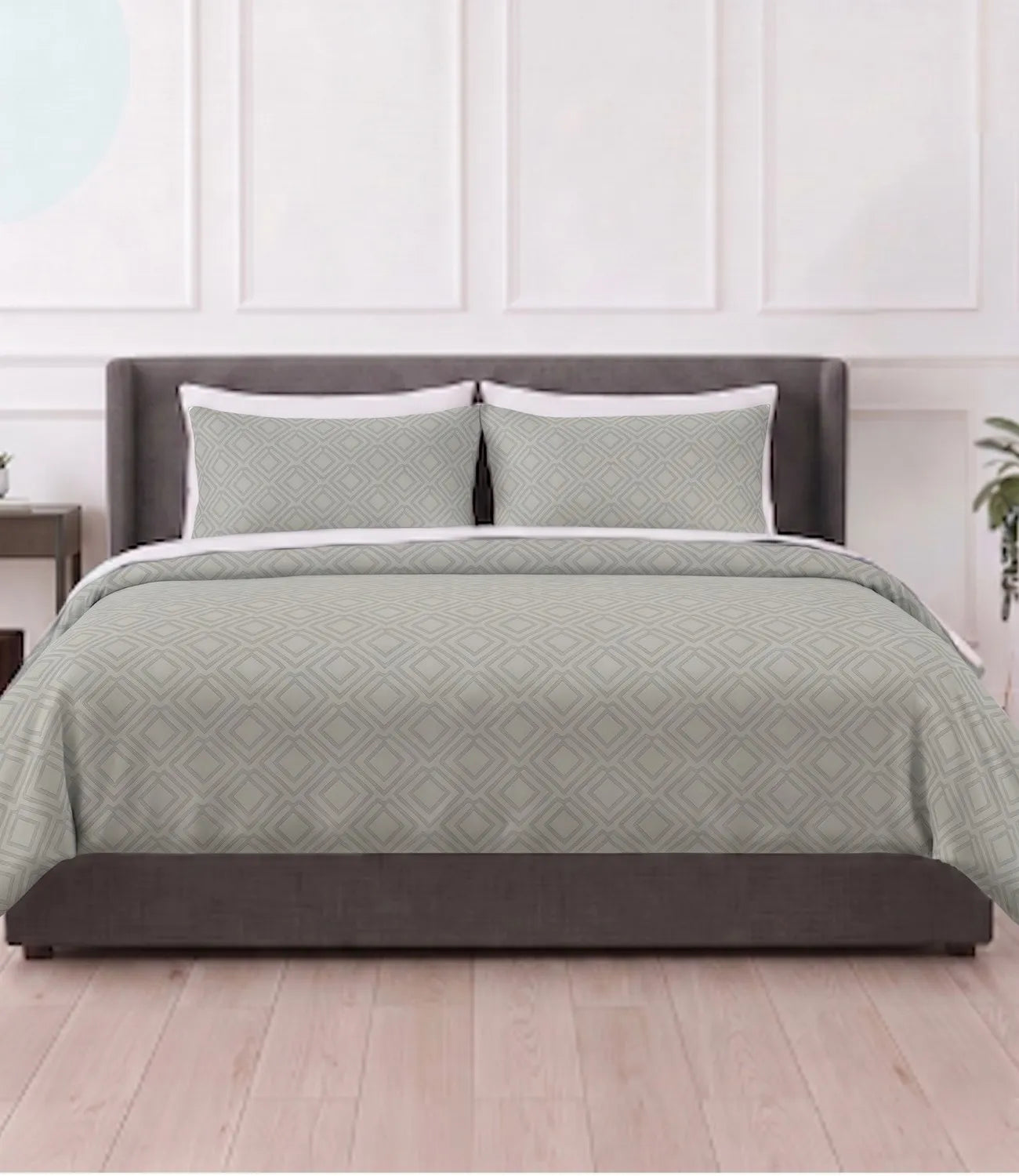 Mayra tea green king size cotton bedsheet with matching pillow covers featuring a modern geometric diamond pattern in a contemporary bedroom.