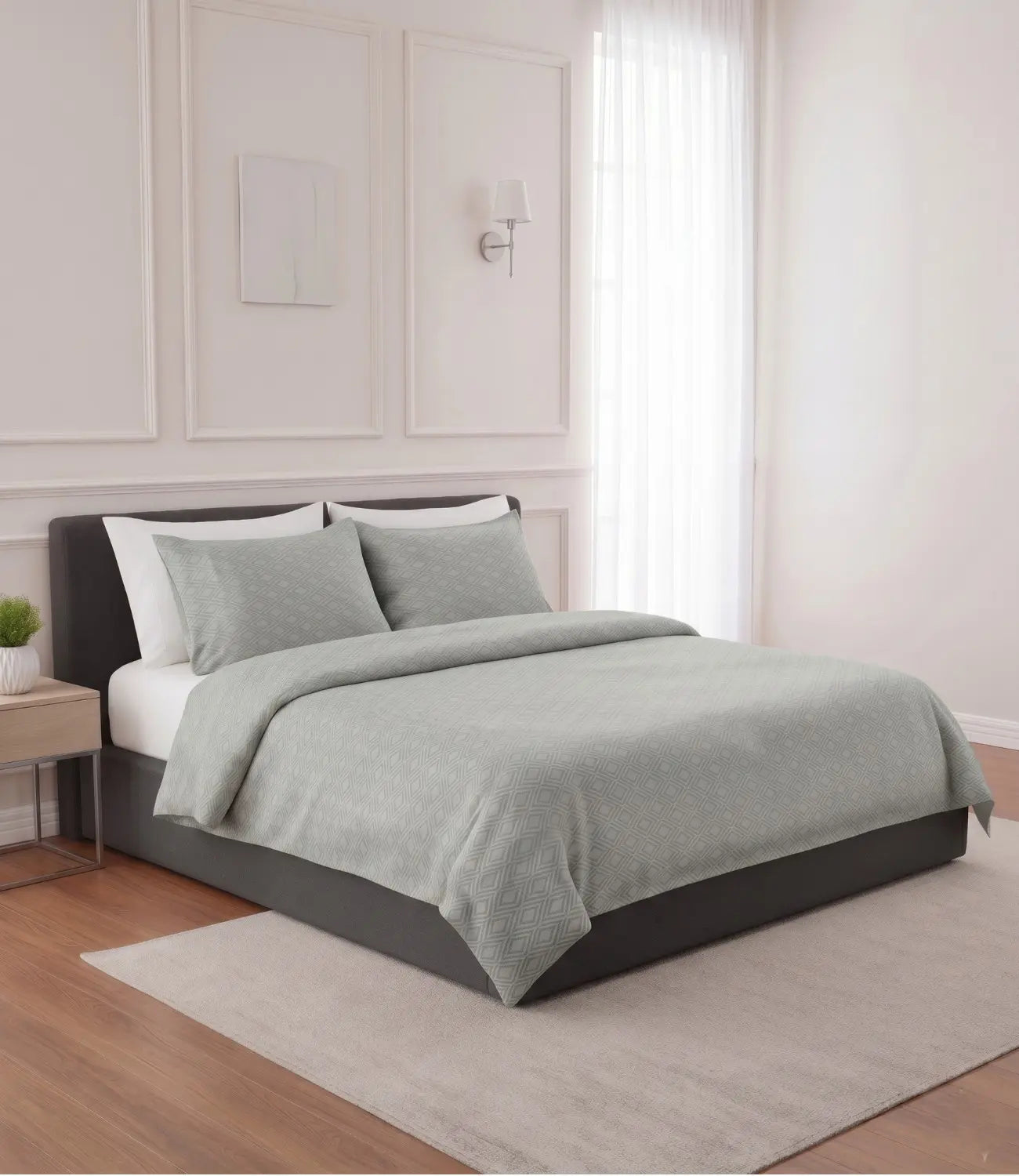 Luxury Mayra tea green king size cotton bedsheet set with elegant geometric diamond print styled on a modern upholstered bed in a minimalist bedroom.