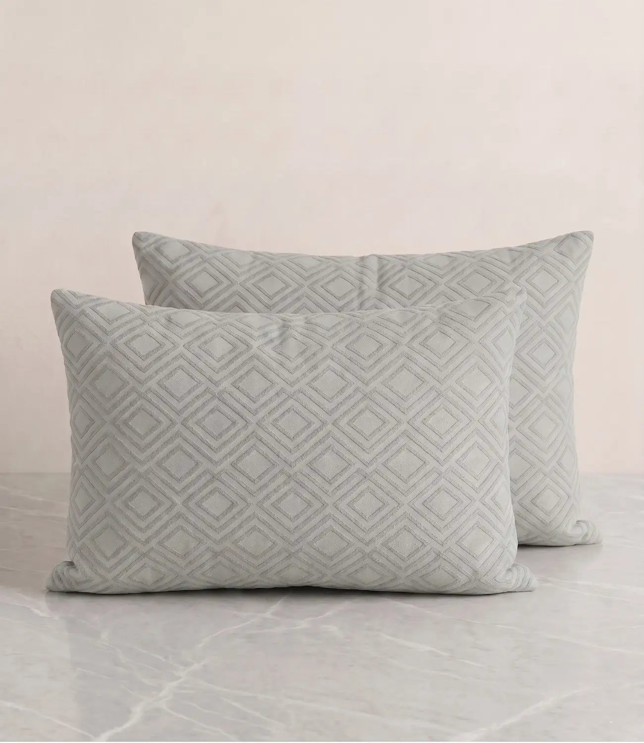 Pair of Mayra tea green cotton pillow covers with sophisticated geometric diamond pattern for modern bedroom décor.