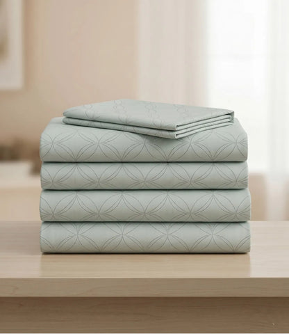 Folded king size 100% pure cotton tea green geometric bedsheet showcasing breathable cotton fabric, subtle circular pattern, premium craftsmanship, durable stitching, and long-lasting comfort.
