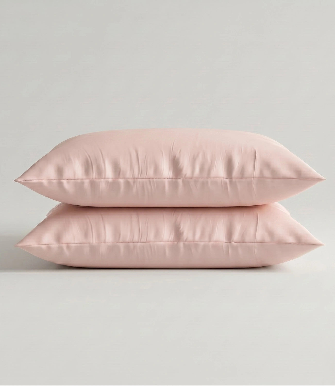 Set of two Cameo Rose cotton pillow covers with a soft, breathable fabric and minimalist solid color design.