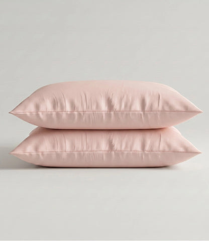 Set of two Cameo Rose cotton pillow covers with a soft, breathable fabric and minimalist solid color design.