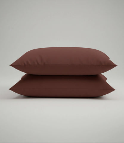 Set of two coffee brown cotton pillow covers for king size bedding, featuring a soft, breathable fabric with a clean, modern design.