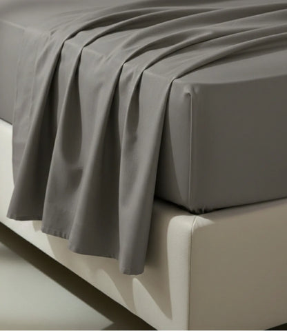 Close-up of Soft Heaven dark grey king size cotton fitted bedsheet highlighting smooth drape, neat stitching, and premium cotton fabric.