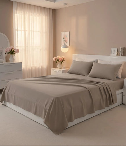 King size taupe cotton bedsheet set with matching pillow covers styled on a modern bed in a cozy minimalist bedroom
