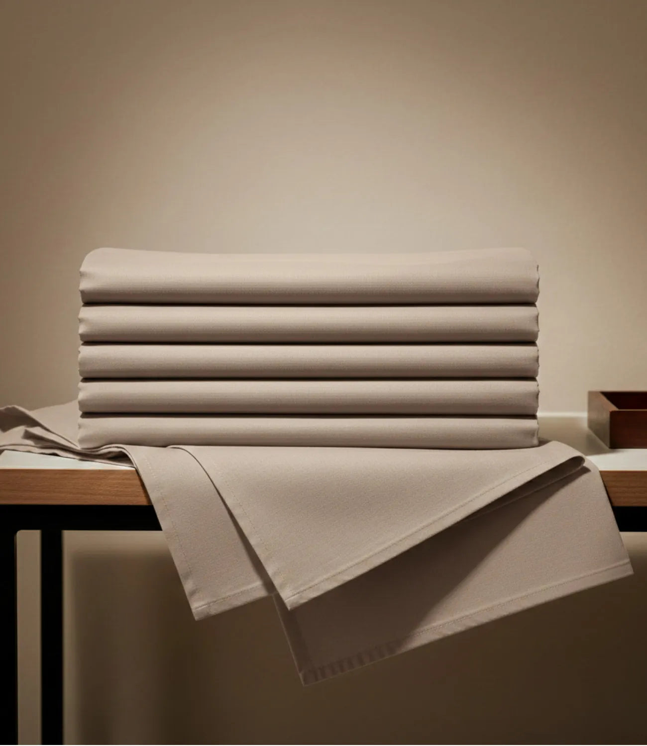 Neatly folded taupe king size cotton bedsheet showcasing premium soft breathable fabric and durable finish