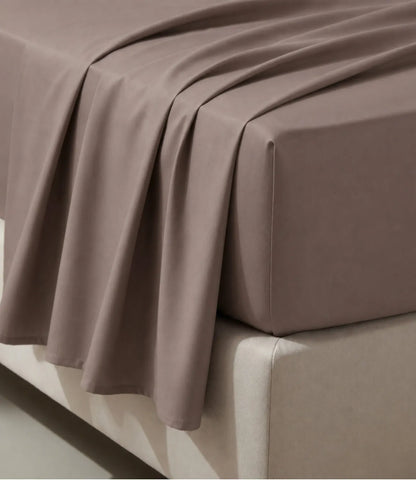 Close-up of taupe king size cotton bedsheet highlighting smooth texture, elegant drape, and premium stitching