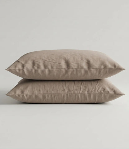 Matching 100% pure cotton mocha solid pillow covers featuring a soft breathable fabric, premium stitching, and elegant minimalist styling for a refined bedroom.