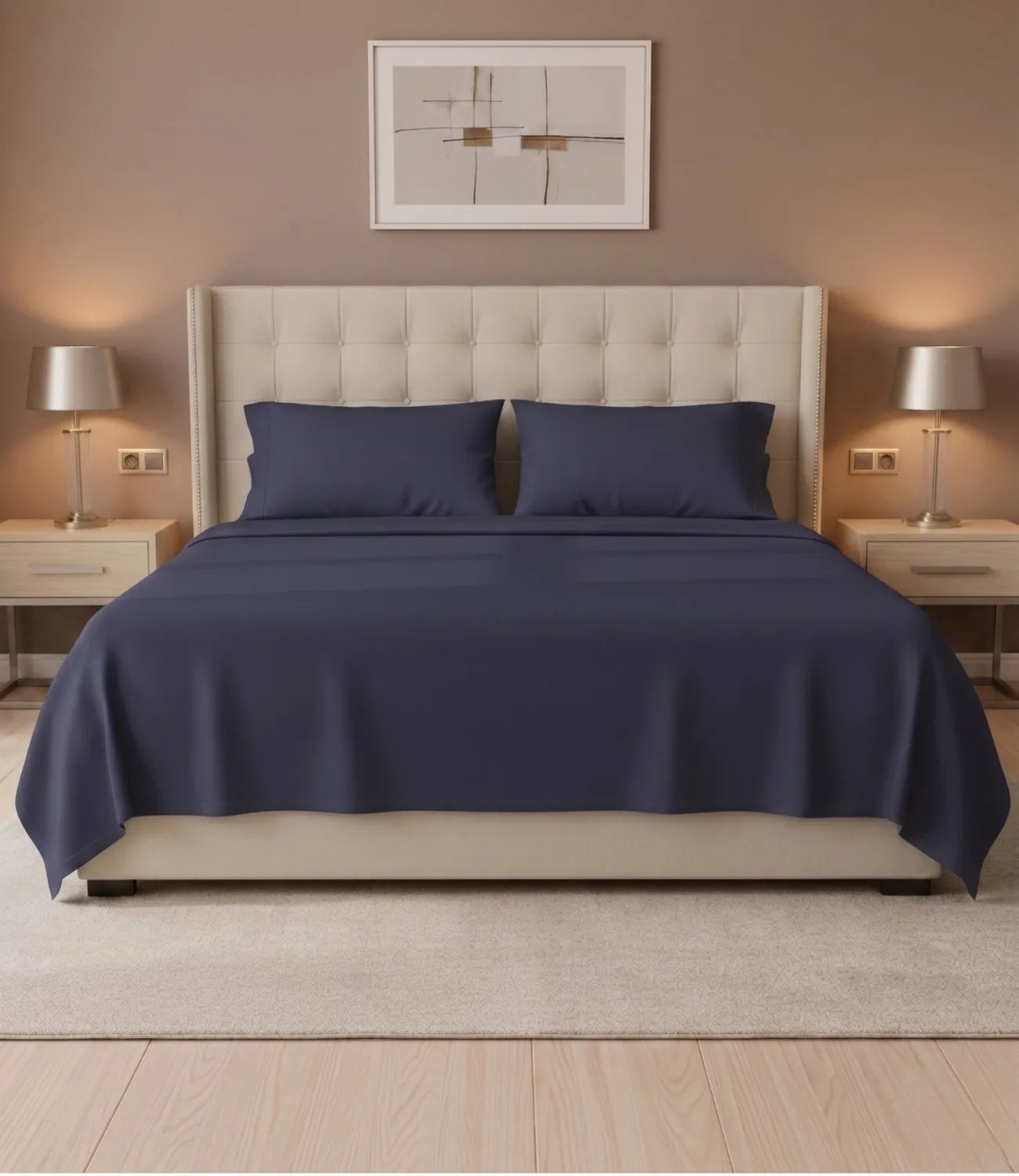 Front view of Soft Heaven navy blue king size cotton bedsheet with two matching pillow covers on a cushioned headboard bed, highlighting a minimalist design and premium cotton fabric.