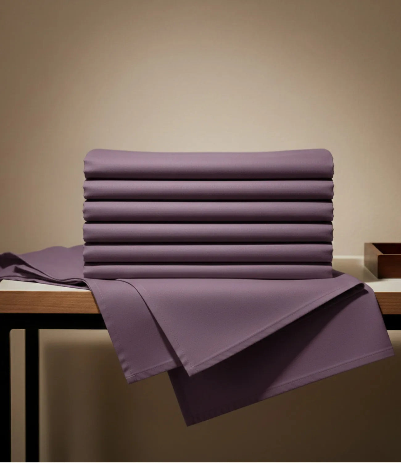 Folded Soft Heaven plum king size cotton bedsheet showcasing soft breathable fabric and rich solid plum color.