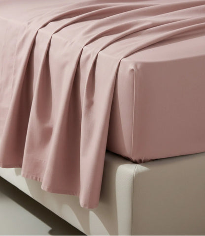 Close-up of Soft Heaven rose gold king size cotton bedsheet showing smooth breathable fabric, elegant drape, fine stitching, and premium quality finish.