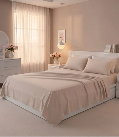 Soft Heaven smoke grey king size cotton bedsheet styled on a modern bed with matching pillow covers in a bright minimalist bedroom.