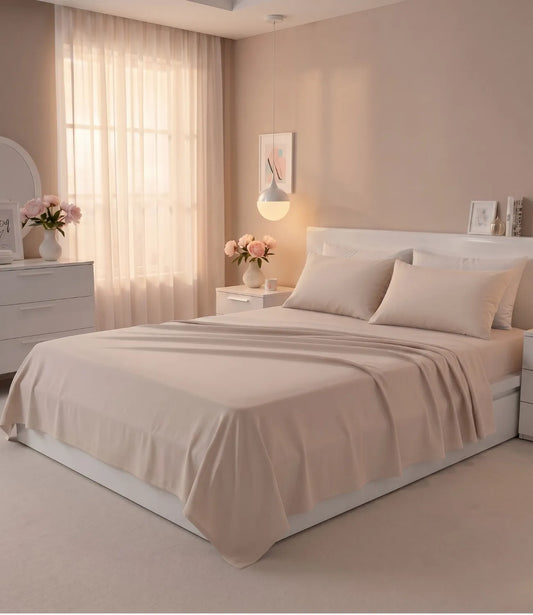 Soft Heaven smoke grey king size cotton bedsheet styled on a modern bed with matching pillow covers in a bright minimalist bedroom.