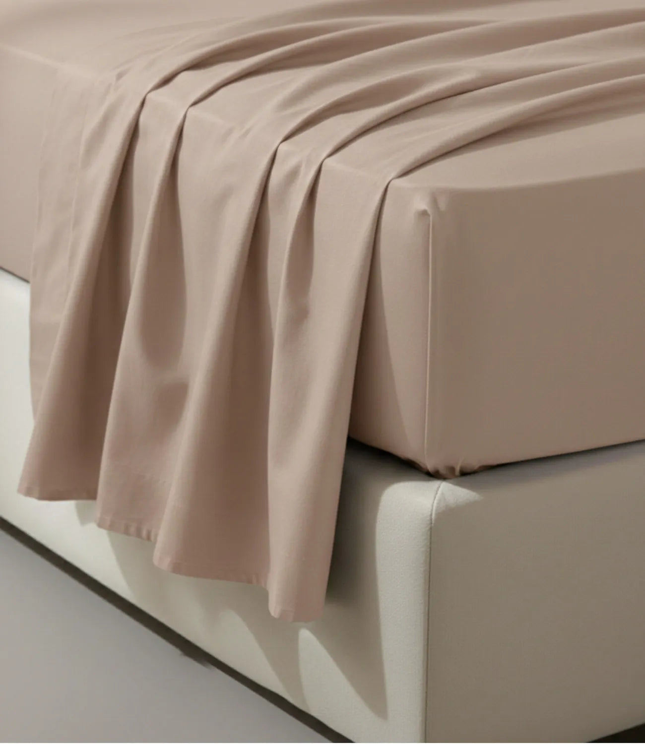 Close-up of Soft Heaven smoke grey king size cotton bedsheet highlighting wrinkle-resistant fabric, elegant drape, and fine stitching.